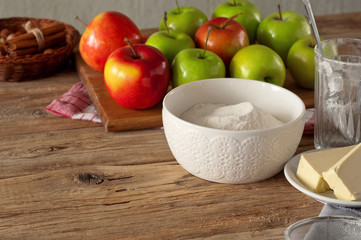flour with ingredients for making apple pie