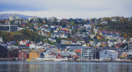 Beautiful super wide-angle panoramic aerial view of Tromso, Norway with harbor and skyline with scenery beyond the city, sunny summer day with blue sky
 - obrazy, fototapety, plakaty