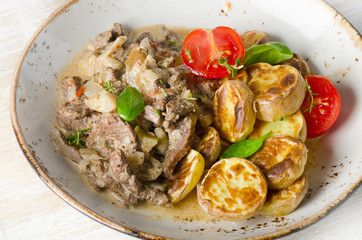 Beef stroganoff with roasted potatoes.