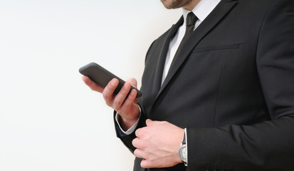 close up shot of business man hands holding a phone on white bac