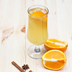 Lemonade with orange and spices on the table