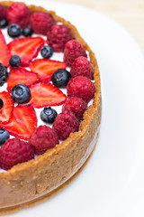 Cheesecake with fresh berries o the table