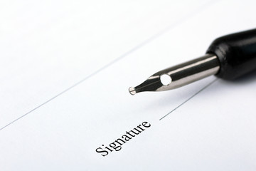 A business contract is a closeup of the signature