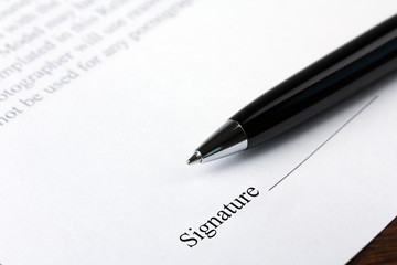 A business contract is a closeup of the signature