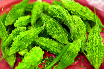 Vegetables. Healthy Food. Close Up Of Organic Fresh Green Asian Bitter Gourd ( Bitter Melon, Momordica Charantia ) In The Farmers Market In Thailand, Asia. Nutrition, Eating Vitamins. Ingredient.