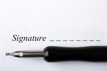 A business contract is a closeup of the signature