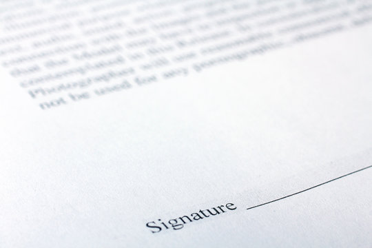 A business contract is a closeup of the signature