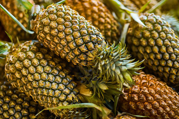 Fruit Background. Closeup Of Organic Ripe Pineapples At Street Farmers Market ( Supermarket ) In Thailand, Asia. Nutrition And Vitamins. Healthy Raw Diet Food. 