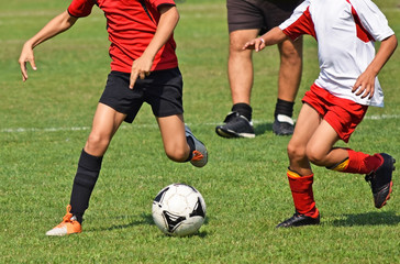 Children are playing soccer