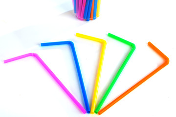 Drinking straw colored plastic tubes isolated on white background