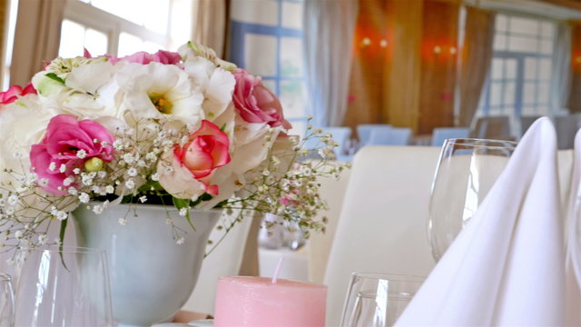 Wedding decorated tables with flowers and candles
