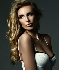 Naklejka premium sensual glamour portrait of beautiful blond woman model lady with fresh makeup and healthy curly hair