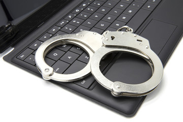 Handcuffs on laptop