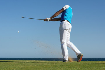 Golfer hitting ball with force. The grass distribution The blur of golf © pavel1964