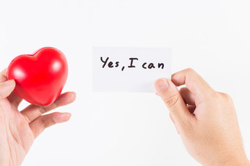 A man's hand handle with heart and a card