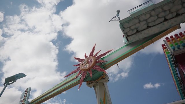 Pendulum Ride in Summer Day, Paris - 60fps. The Fete foraine du Jardin des Tuileries is a small amusement park that is set up every summer in the Tuileries Gardens in Paris