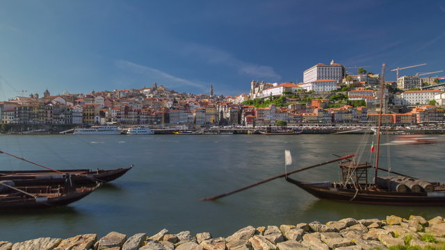 Porto, Portugal old town skyline on the Douro River with rabelo boats timelapse hyperlapse.