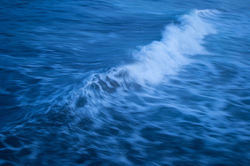 Fototapeta na wymiar Moving Ocean Wave With White Mist