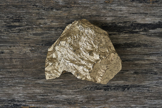 Gold ore on wood plate