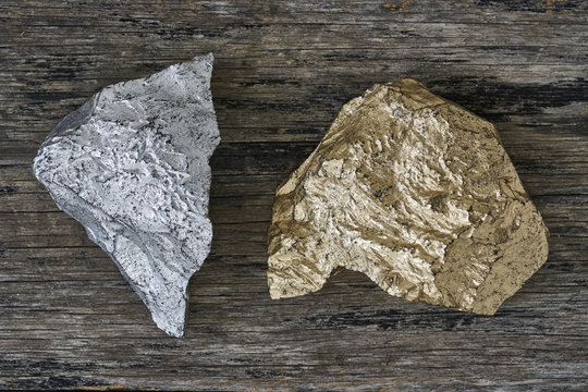 Gold and Silver ore on wood plate