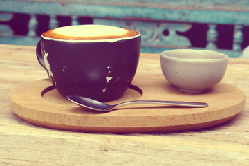 The coffee set; cup of coffee, spoon, cookies in vintage tone, like instagram filter effect