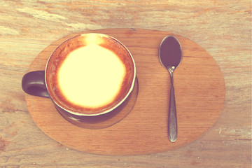 The coffee set ; a cup of hot coffee with silver spoon in vintage tone, like instagram filter effect