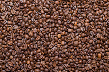 coffee beans on the table a lot of brown texture close