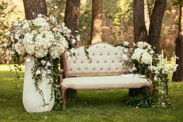 luxury wedding decorations with bench, candle and flowers compis - Powered by Adobe