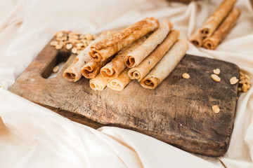 nuts and coconut waffles on a cutting board and silk fabric food