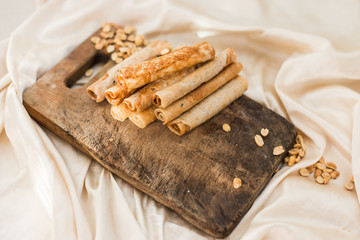 nuts and coconut waffles on a cutting board and silk fabric food