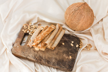 nuts and coconut waffles on a cutting board and silk fabric food