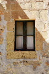 Window in a limestone building