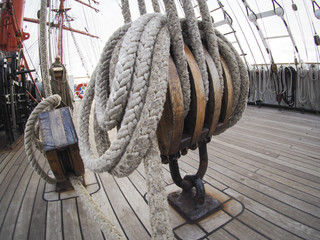 closeup of block or halyard ulley on huge sailing ship