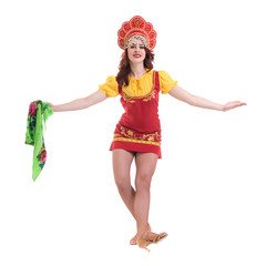 Young woman wearing a folk costumes dancing.  Isolated on white in full length with copyspace