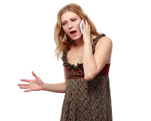 Young angry  woman talking on the phone