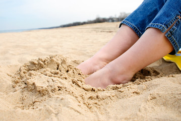 Female Feet in Sand at Beach