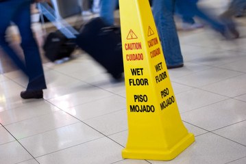 Caution Wet Floor Sign with People Walking Picture