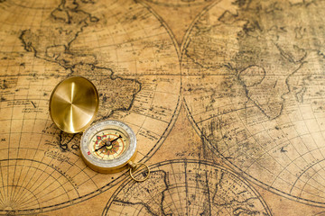 Fototapeta na wymiar old compass on vintage map