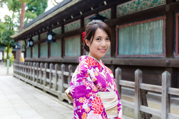 Asian Woman wearing the kimono dress at temple