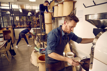 Coffee roastery and distribution company with men at work