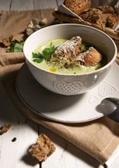 Broccoli cream soup with croutons and cheese