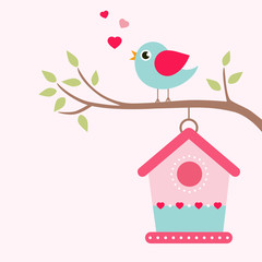 bird house and bird on a branch