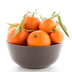 Tangerines on ceramic brown  bowl