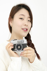 Asian young woman with old film camera