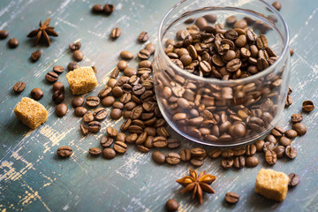 Bank of coffee beans on the old wooden background
