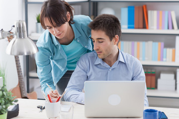 Young couple at home making plans