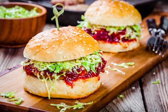 Burgers With A Cutlet Of Turkey, Cranberry Sauce And Salad