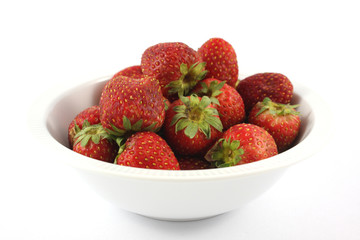 rotten old strawberry in white blow on white background