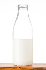 bottle of milk on wood