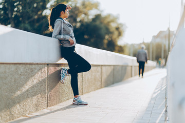 Beautiful woman resting after jogging